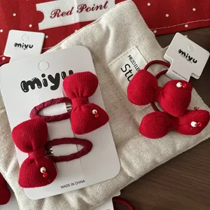 Set de barrettes et chouchous nœuds en tricot rouge pour filles avec détails perlés