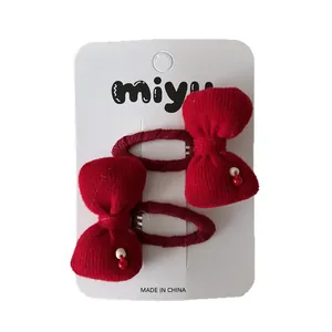 Paire de barrettes à nœuds rouges tricotés pour filles avec perles à pois