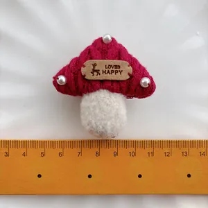 Cute red mushroom hair clip for girls featuring 3D knit design and white pearl details