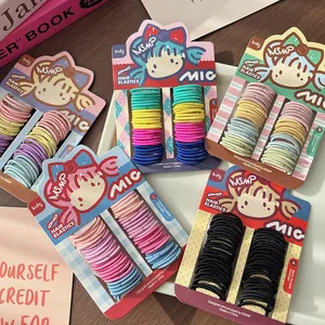 Dettaglio di elastici per capelli colorati e resistenti per bambini su schede grafiche