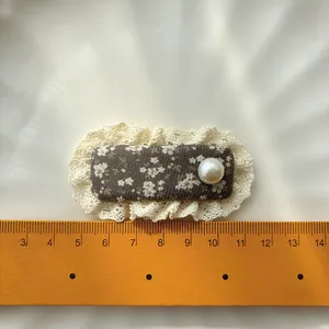 Floral fabric hair clip with white lace trim and pearl accent for girls, vintage style