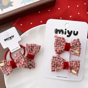Handmade red tweed bow hair clips and hair ties set with golden metal details for girls