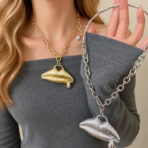 Statement oversized textured gold lips pendant necklace with a thick chunky chain link