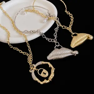 Chunky retro chain necklaces featuring textured 3D lip and crystal lock pendants in gold and silver