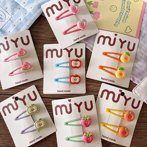Cute fruit hair clips set for girls featuring colorful resin strawberry and peach designs