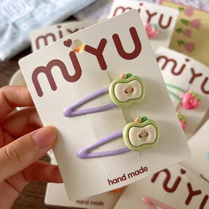 Cute apple-shaped fruit hair clips for girls featuring light purple enamel finish