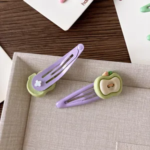 Cute fruit-shaped hair clips for girls featuring avocado green and purple metal designs