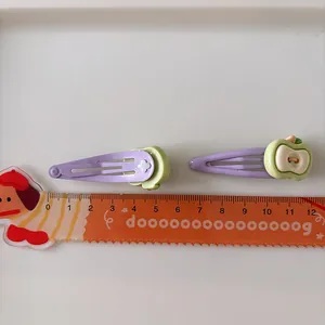 Set of two purple metal BB hair clips with green apple charms, 5cm length for girls