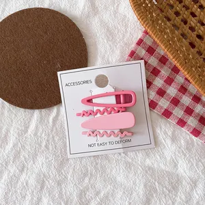 Lot de quatre barrettes à cheveux roses mates en forme de goutte et de vague