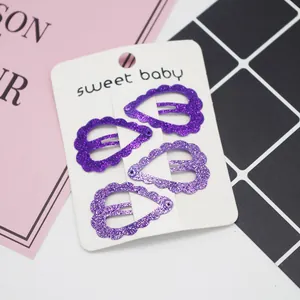 Lot de quatre pinces à cheveux violettes en forme de cœur avec paillettes brillantes