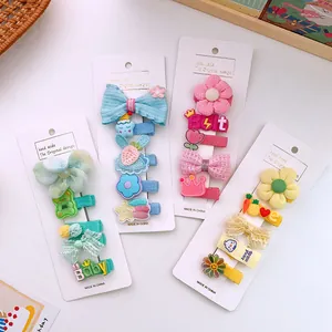 Detailed set of cute handmade fabric hair clips for girls in various colorful cartoon designs