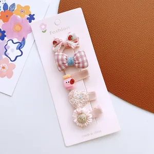 Detail of 5pcs cute girls hair clips set with strawberry and floral patterns