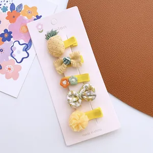 Detailed set of 5 yellow handmade hair clips for girls including embroidery and floral bows
