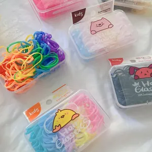 Macro shot of colorful high elasticity TPU hair bands in cute cartoon packaging boxes
