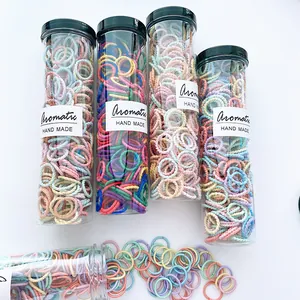 Macro shot of 300pcs kids high-elastic colorful hair ties in clear storage containers