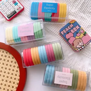 Macro shot of colorful high elasticity hair bands in a transparent storage box