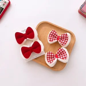 Red plush velvet and houndstooth bow hair clips for kids in festive winter style