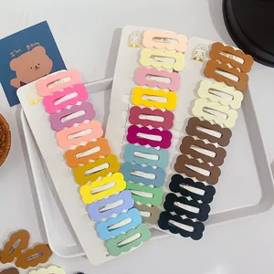 Detailed set of matte pastel wavy hair clips on a white display card with various colors