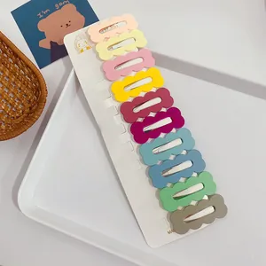 Set of 10 colorful wavy matte hair clips neatly arranged on a white display card