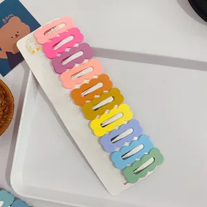 Set of 10 colorful wavy BB hair clips in pastel candy colors on a display card