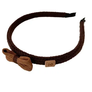 Brown knitted headband featuring a double layer side bow and a cute rabbit fabric patch