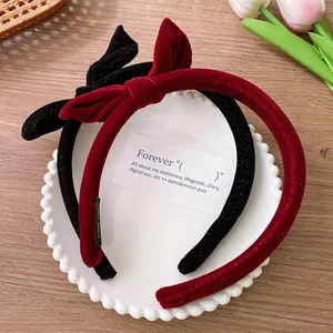 Retro velvet bow headbands in burgundy and black with handmade labels for women