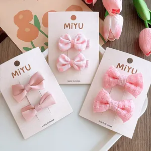 Set di 3 paia di fermagli per capelli rosa con fiocchi a pois e motivi a quadri