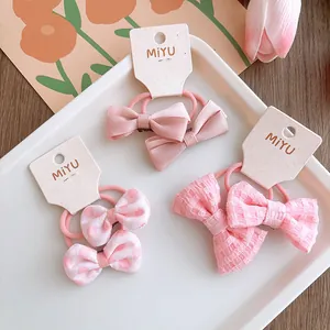 Set elastici per capelli rosa con fiocchi a pois e raso per bambine in confezione regalo