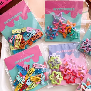 Colorful star-shaped hair clips for girls set in candy colors on card packaging