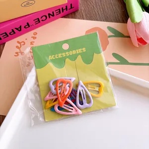 Colorful heart-shaped hair clips in various candy colors shown in retail packaging