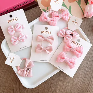 Set di fermagli e elastici per capelli rosa con pois e motivi a quadri per bambine