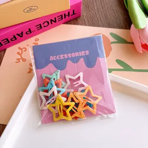Detail of colorful star hair clips set in OPP bag with accessories card backer