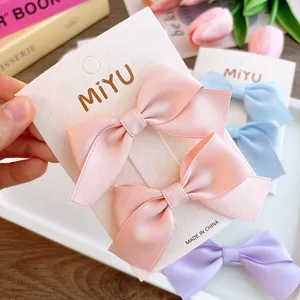 Sweet macaron-colored satin bow hair clips set for girls on a display card