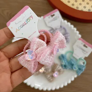 Kids tweed bow hair ties set with heart crystals in assorted colors on card