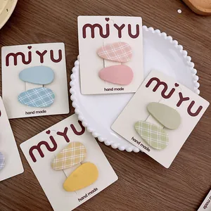 Juego de dos pinzas para el cabello BB de tela en colores macaron y estampados de cuadros