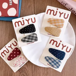 Set of fabric covered triangle hair clips with floral and plaid patterns for girls
