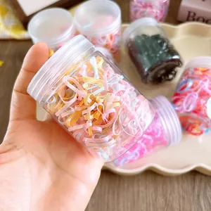 Jar of 200 colorful high-elastic disposable hair bands for kids and girls in sweet candy colors