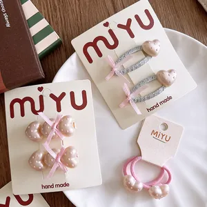 Set di fermagli per capelli rosa con cuori e fiocco a pois per bambine