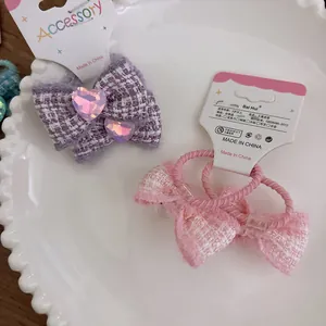 Sweet tweed bow hair ties and clips with heart gem for girls, set in white porcelain dish