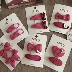 Set di fermagli per capelli rosa per bambine con fiocchi in tessuto a quadri e velluto