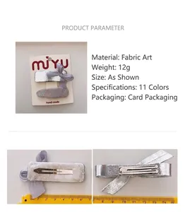 Detail view of 6.5cm silver bow hair clip with textured fabric and scale measurement