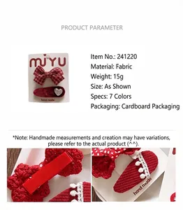 Macro detail of red plaid bow and knitted heart hair clip for girls with packaging