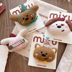 Set of four plush 3D cartoon animal hair clips featuring a brown bear and white dog design