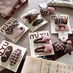 Pink and brown fabric bow hair clips and plush star hair ties set for girls