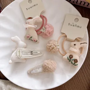 Sweet 4-piece set with embroidered bunny hair clips and plush ball hair ties for girls