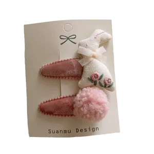 Pink velvet kids hair clips set with embroidered bunny and soft plush ball on display card