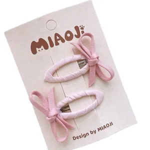 Lot de jolies barrettes nœuds en tissu rose pour filles sur carte de marque chat