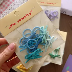 10-piece pack of mini suede candy color bow hair ties for toddlers in blue shades