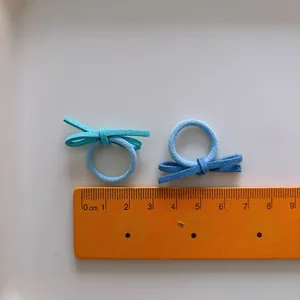 Set of 10 mini candy color bow hair ties for toddlers with elastic thumb rings