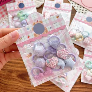 Lot de chouchous pour enfants aux couleurs macarons avec breloques cœur et étoile